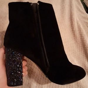 Black velvet ankle booties with a glitter heel.